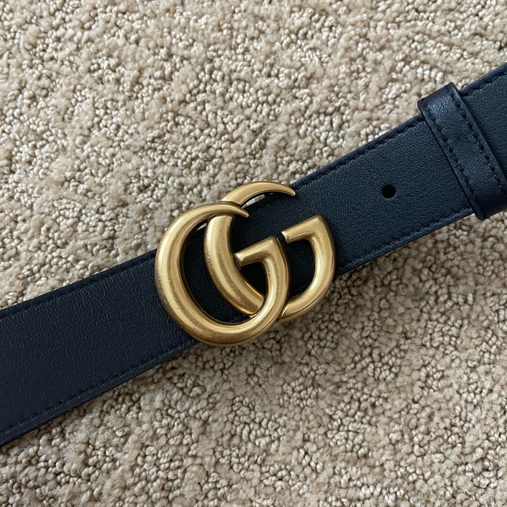 Black leather belt with buckle